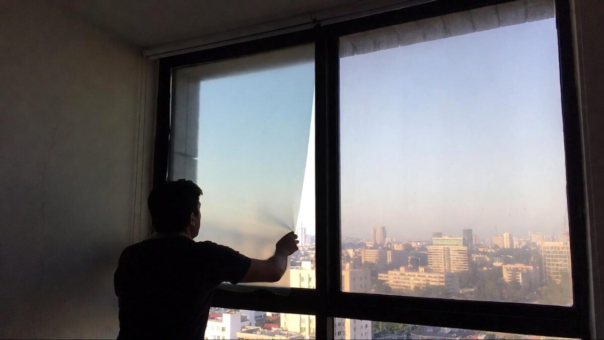 person-installing-window-film-image