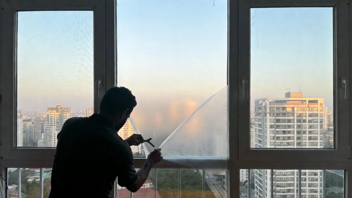 person-installing-window-film-image