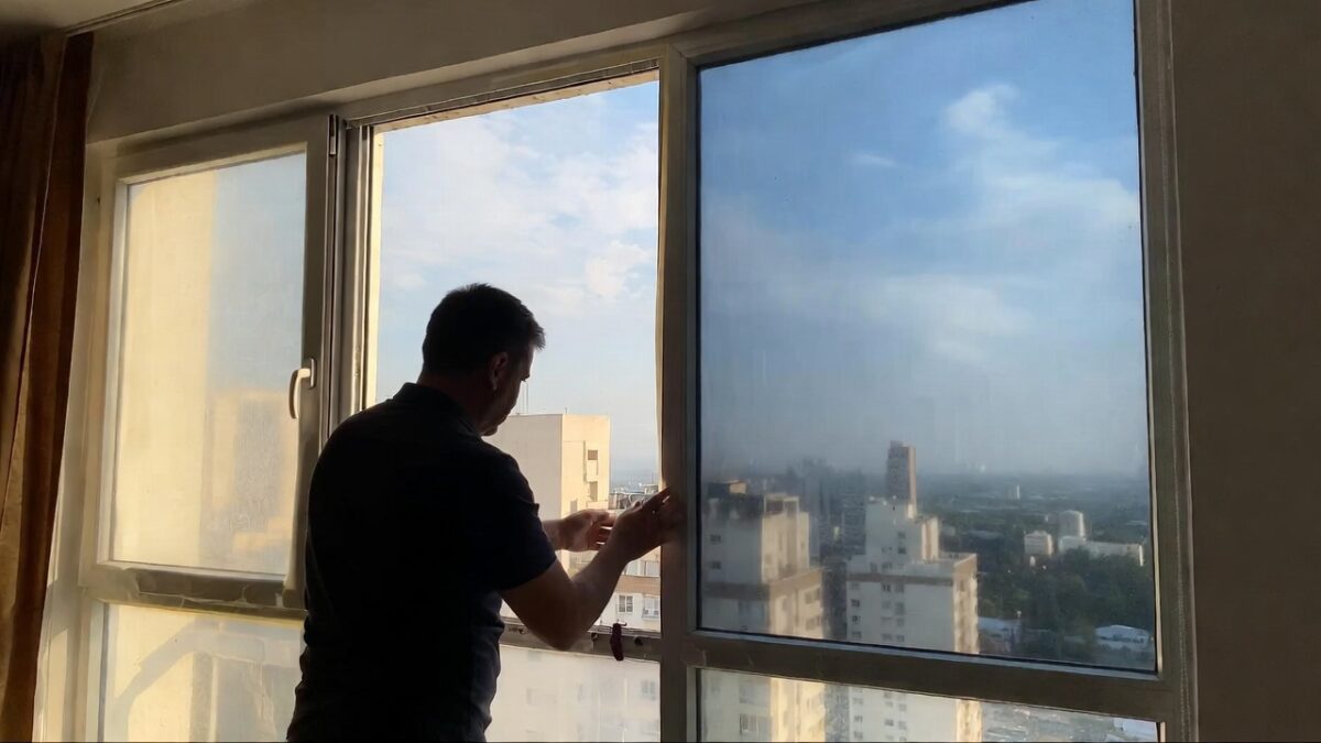 person-installing-window-film-image