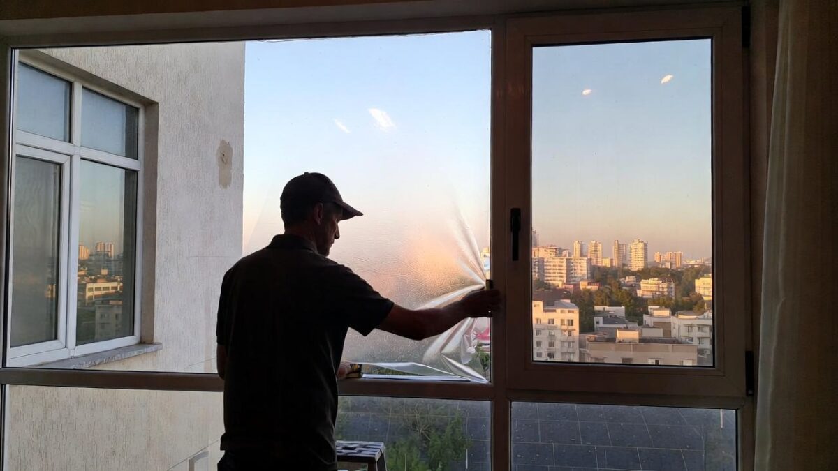 person-installing-window-film-image